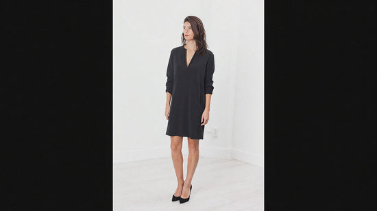 Create a realistic video of this person moving to show the dress